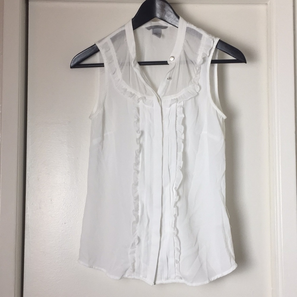 White ruffled blouse. Adorable detail